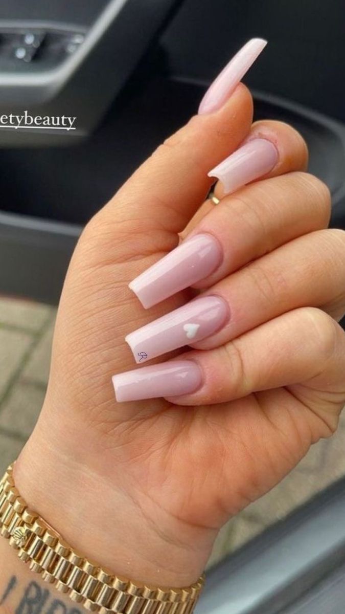 Chic Elegant Nail Design: Soft Pink, Glossy Finish with Whimsical Heart Detail