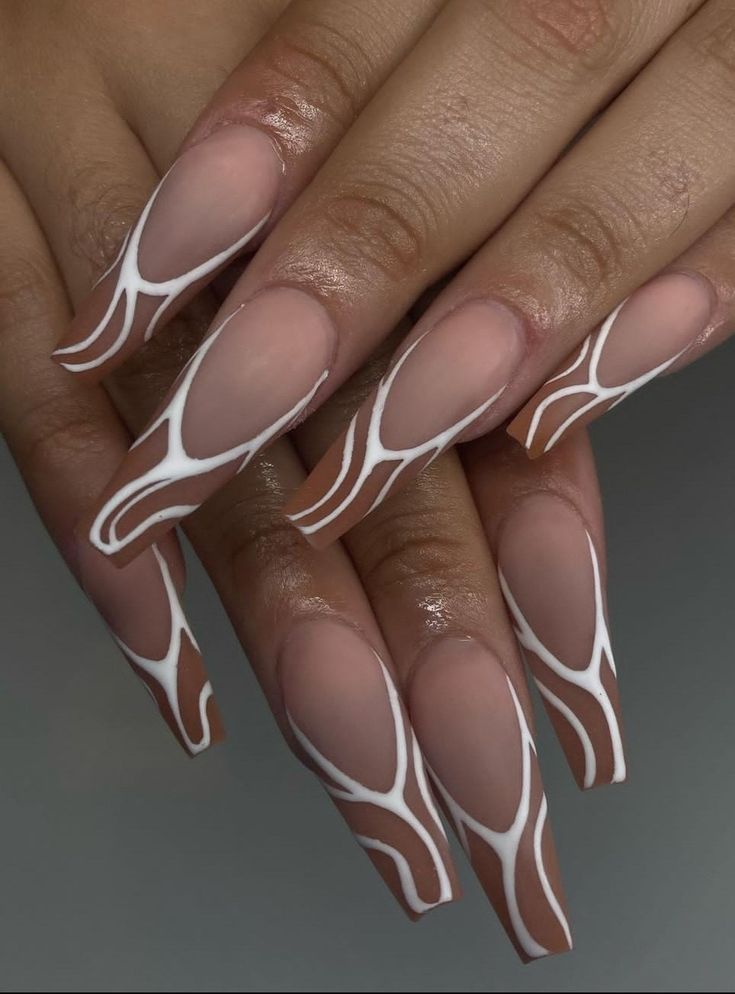 Elegant Long Nude Nails with Modern Abstract White Design.