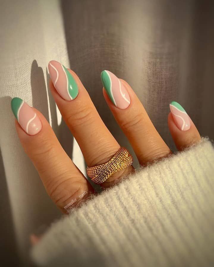 Chic Angular Nail Design in Pastel Pink and Green with Glossy and Matte Finishes.