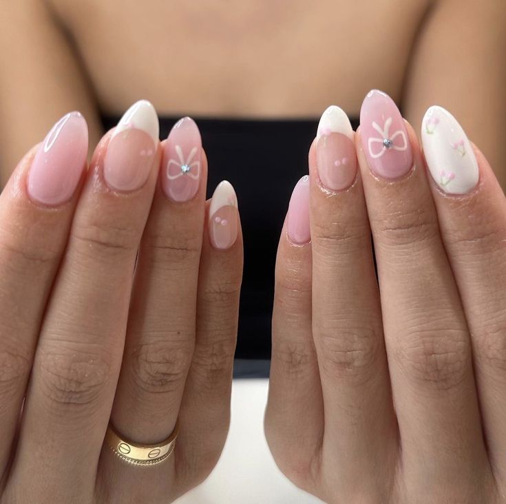 Elegant Pink Nail Design with French Tips, Floral Accents, and Glossy-Matte Finish.