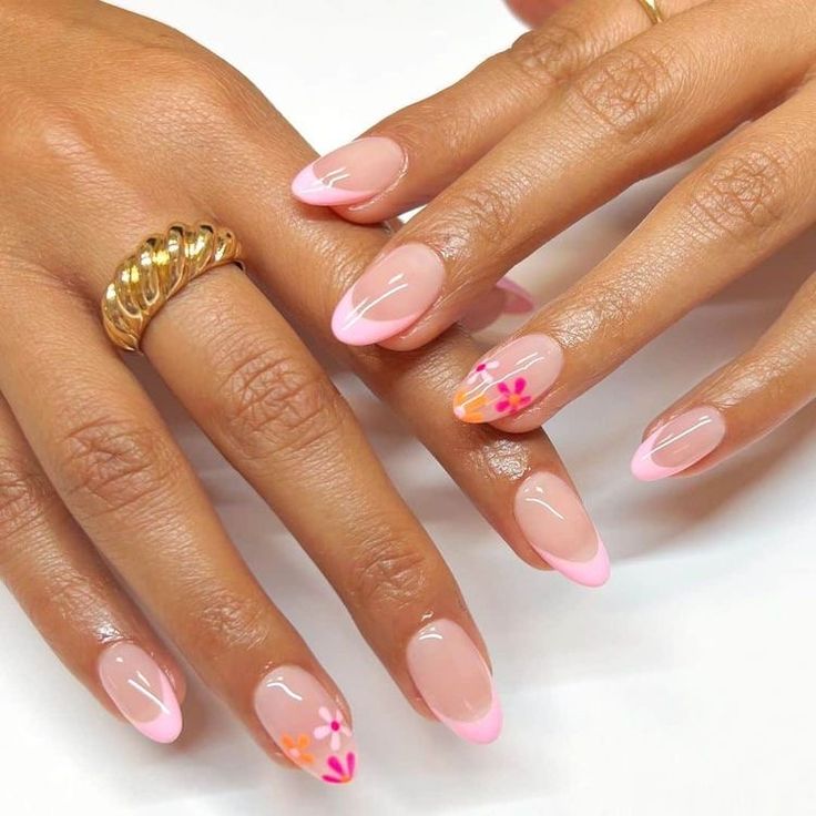 Elegant Spring-Inspired Chic Nail Design: Modern French Tip with Soft Pink Hues and Floral Accents.