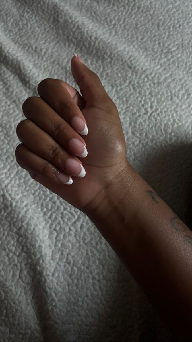 Chic Almond-Shaped Nails: A Sophisticated Blend of Soft Nude and Pristine White Tips