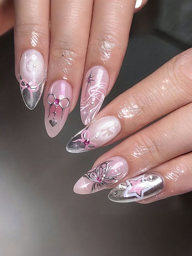 Sophisticated Nail Design Blending Soft Pink and Silver with Playful Intricate Art.