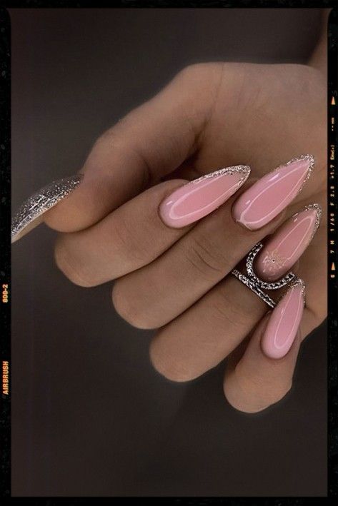 Sophisticated Pink Almond-Shaped Nails with Shimmering Silver Edges for a Modern Classic Look.