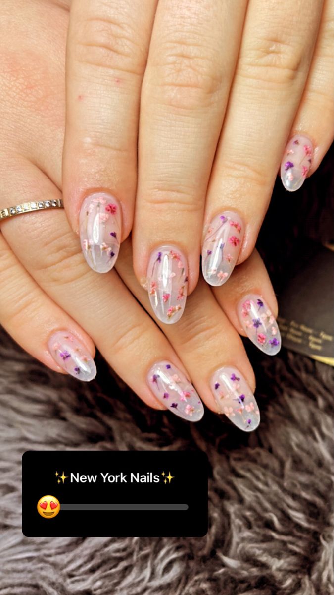 Elegant Floral Nail Design with Clear Base and Soft Gradient