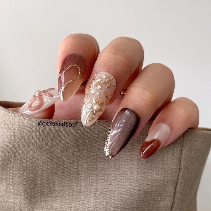 Sophisticated Nail Design: Soft Browns and Neutrals with Floral Embellishments