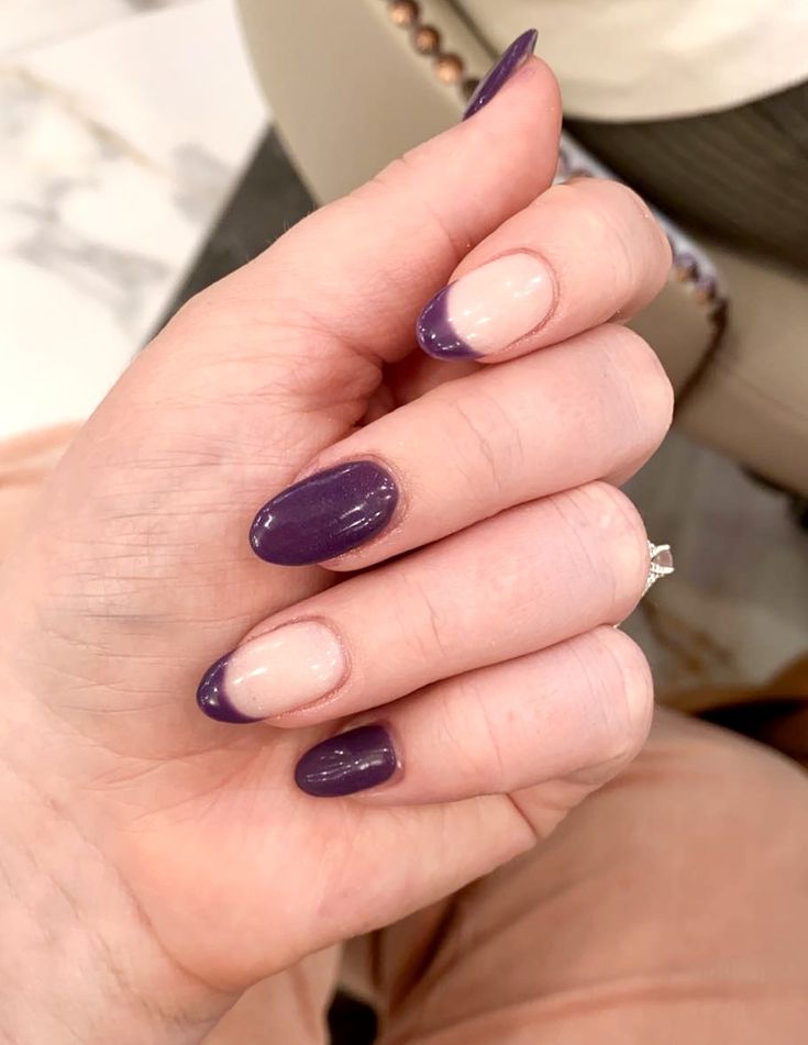 Chic Half-Moon Nail Design in Deep Purple and Soft Nude Shades.