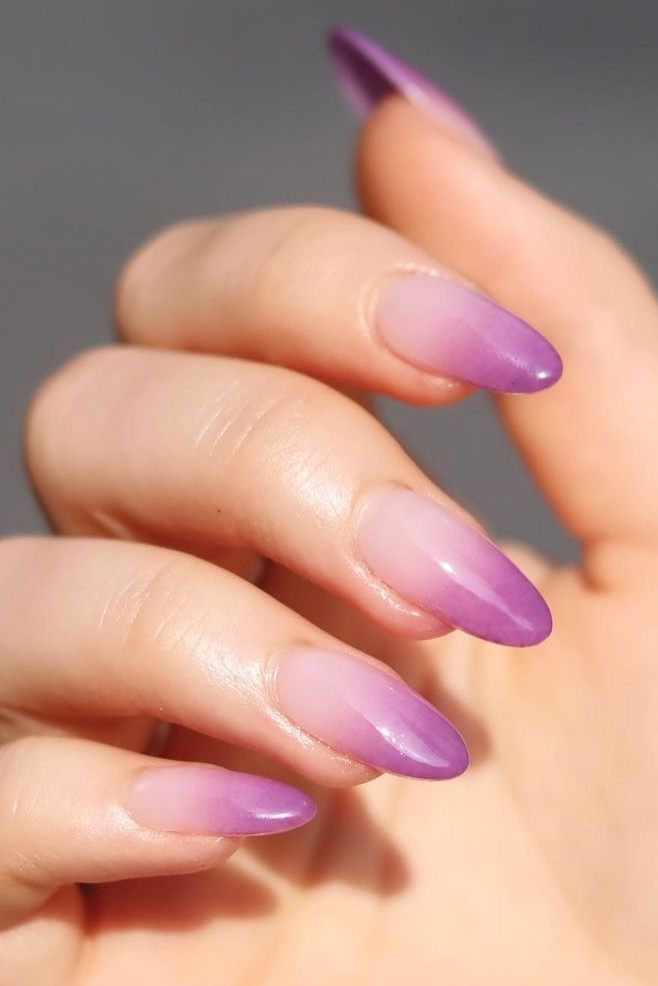 Elegant Ombre Purple Stiletto Nails: A Sophisticated Gradient Design.