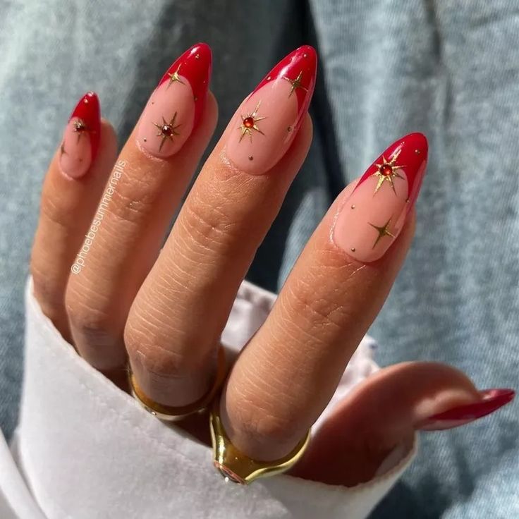 Chic Ombre Red-Tipped Nails with Glamorous Gold Star Accents