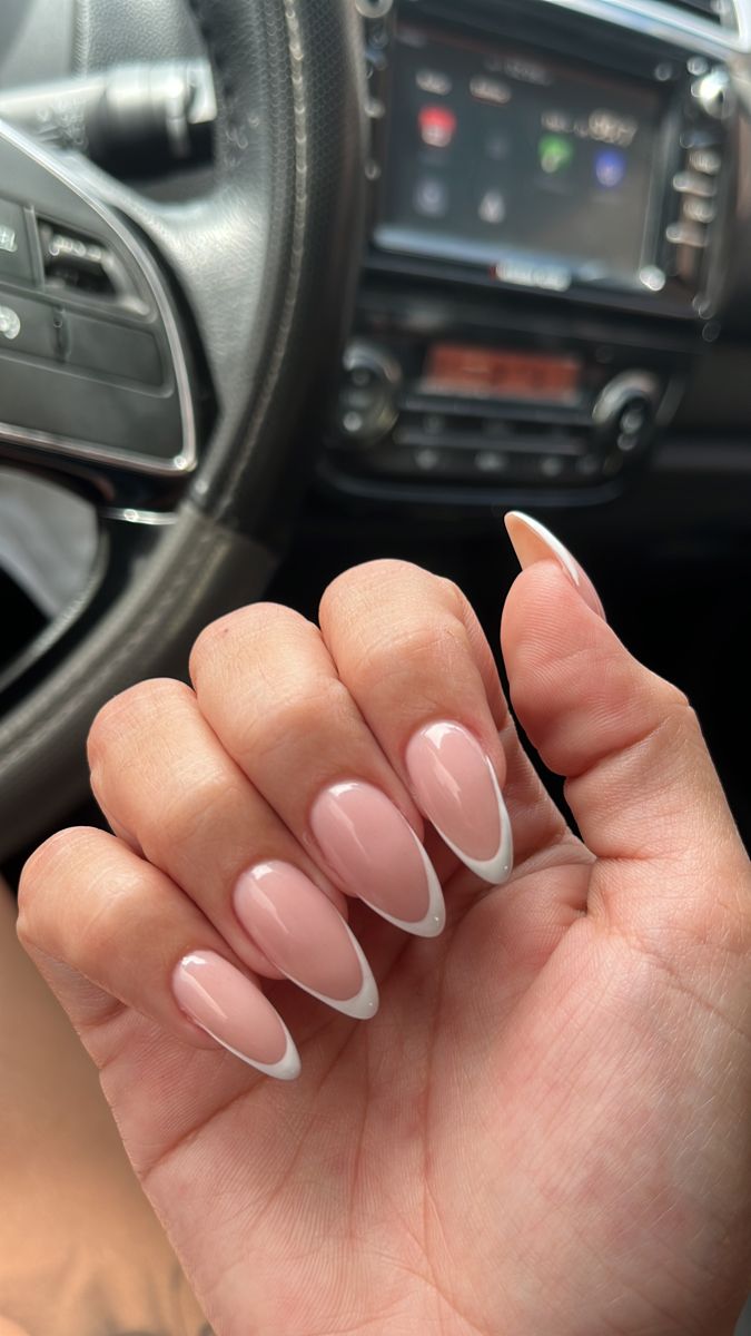 Chic Almond-Shaped Nails: Soft Pink Base with Crisp White Tips for a Modern Take on French Manicure.