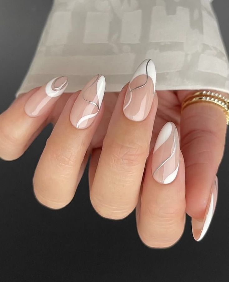 Sophisticated Asymmetrical Nail Design in Nude and White Shades.