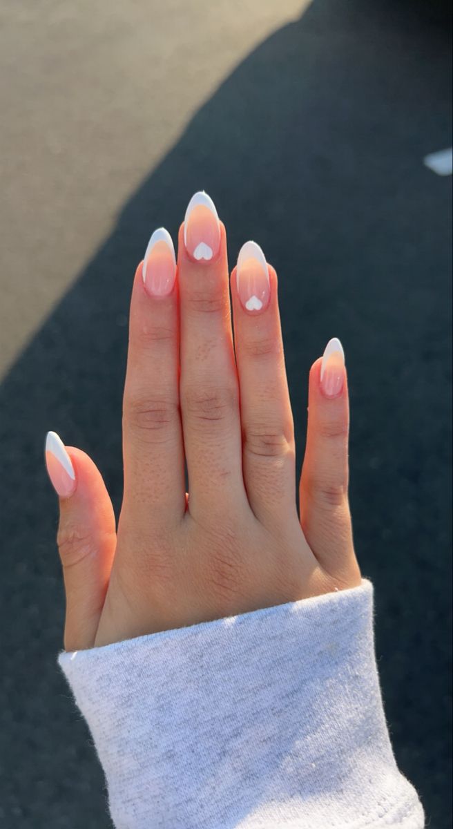 Elegant Ombre Nail Design with Playful Heart Accents