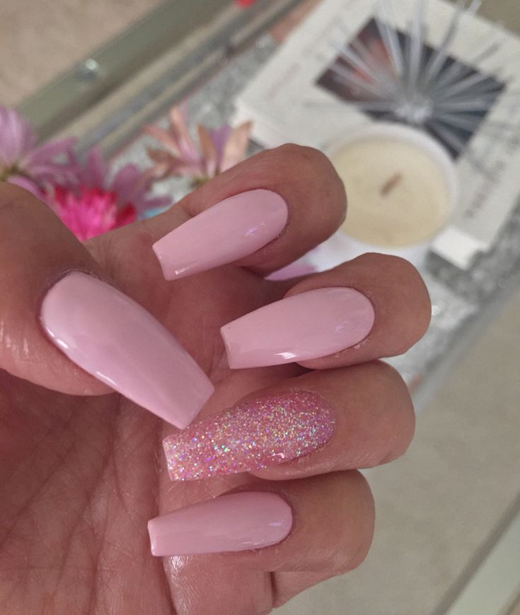 Chic Soft Pink Nail Design with Glossy Finish and Sparkly Accent.