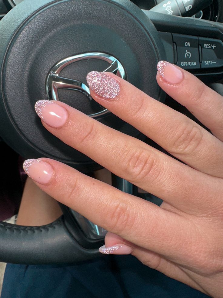 Chic Nude Nail Design with Sparkling Glitter Tips for a Sophisticated Look.