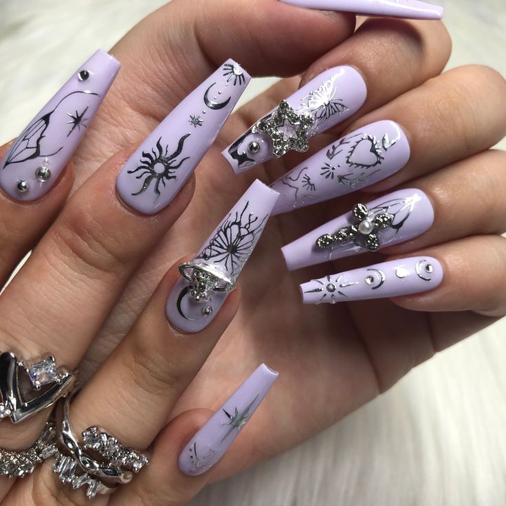 Whimsical Lavender Nail Design with Intricate Black Line Art and Celestial Motifs.