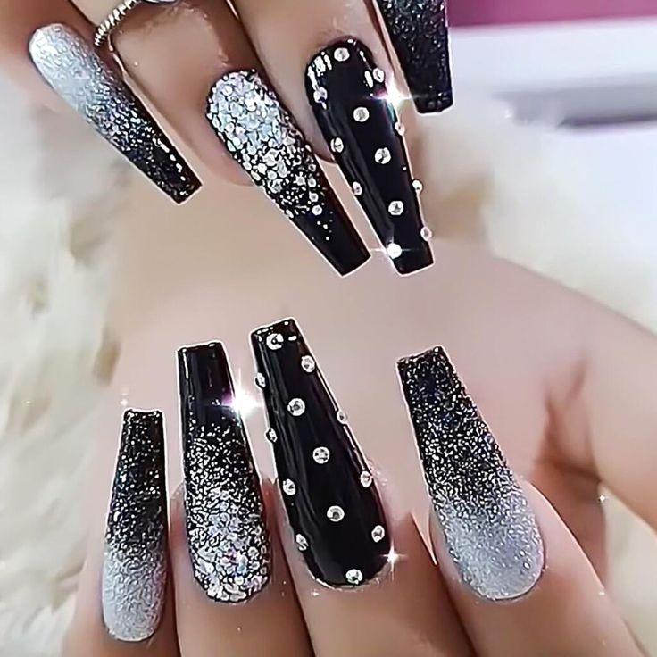 Stunning Black and Silver Nail Design with Glamorous Glitter and Rhinestones.