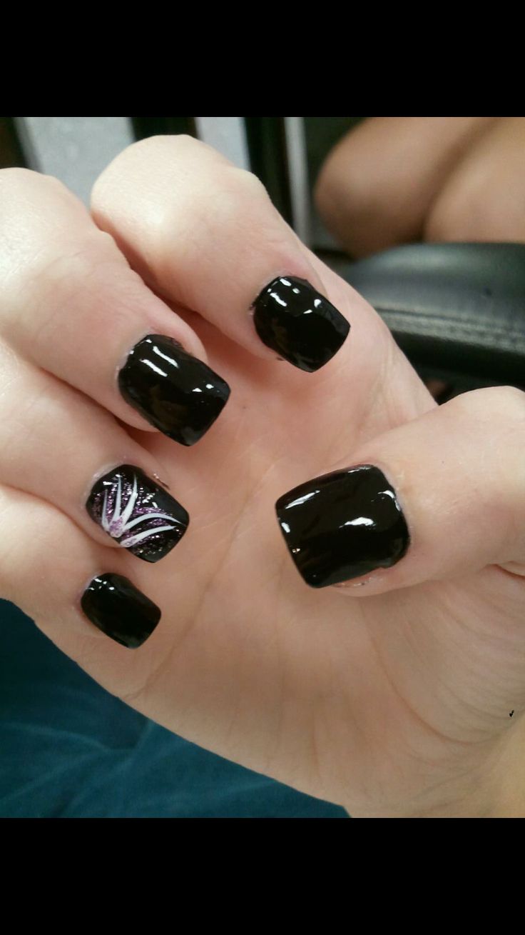 Sophisticated Black Manicure with Playful Design Creates Bold Statement.