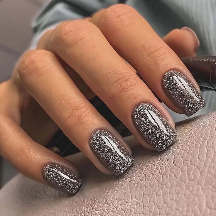 Elegant Grey Glitter Nail Design with Gradient Effect for Glamorous Statement.