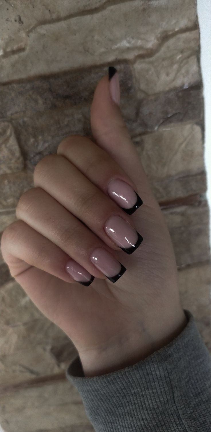 Sophisticated Nude and Black French Tip Nail Design