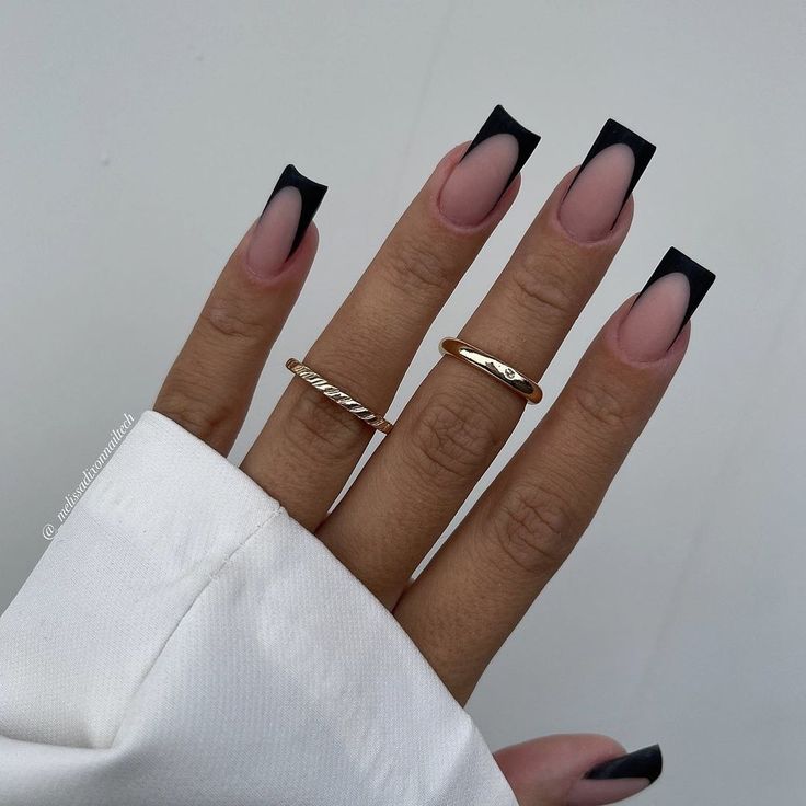 Chic Nude and Black Gradient Nail Design with Long Square Tips and Gold Accents.