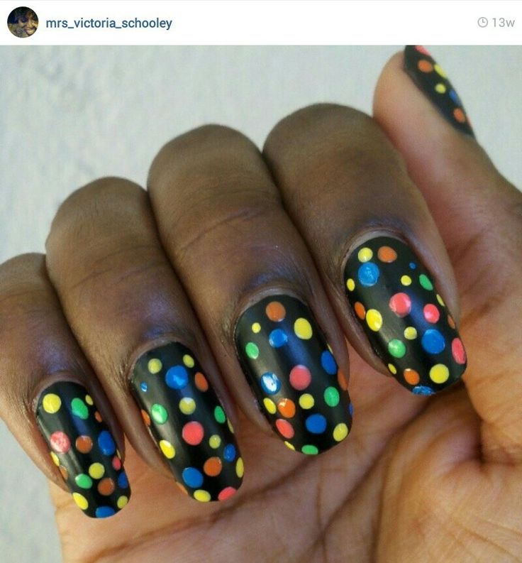 Playful Polka Dot Nail Art on Matte Black Base