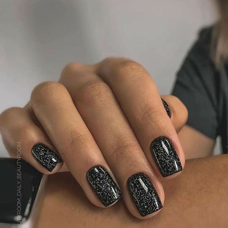 Chic Glittery Black Nail Design: A Striking Contrast for Any Occasion