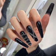 Dramatic Bold Black Stiletto Nails with Chain Accents and Textured Finishes.