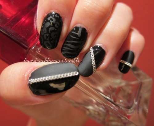 Chic Sleek Black Nail Design with Mixed Finishes, Patterns, and Metallic Accents