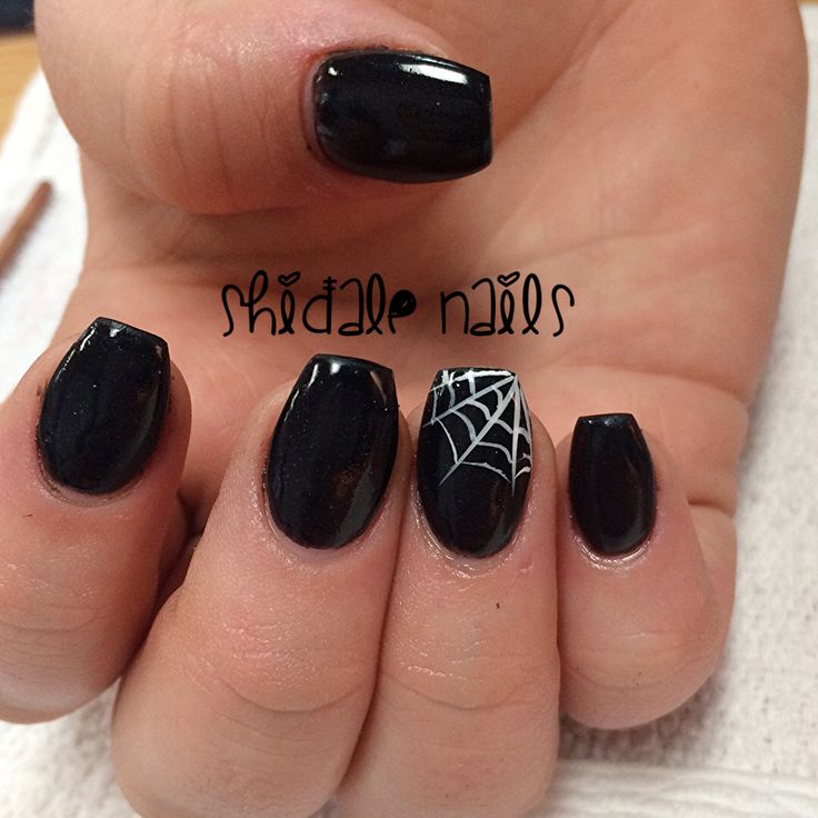 Striking Glossy Black Nails with Whimsical White Spider Web Accents