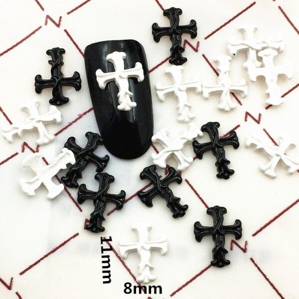 Bold Black and White Cross-Shaped Nail Art: A Striking Fusion of Edgy Elegance and Personal Style.