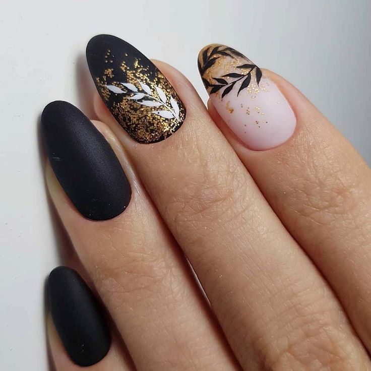 Chic Nail Design Blending Matte Black, Soft Pink, and Gold Leaf Accents.