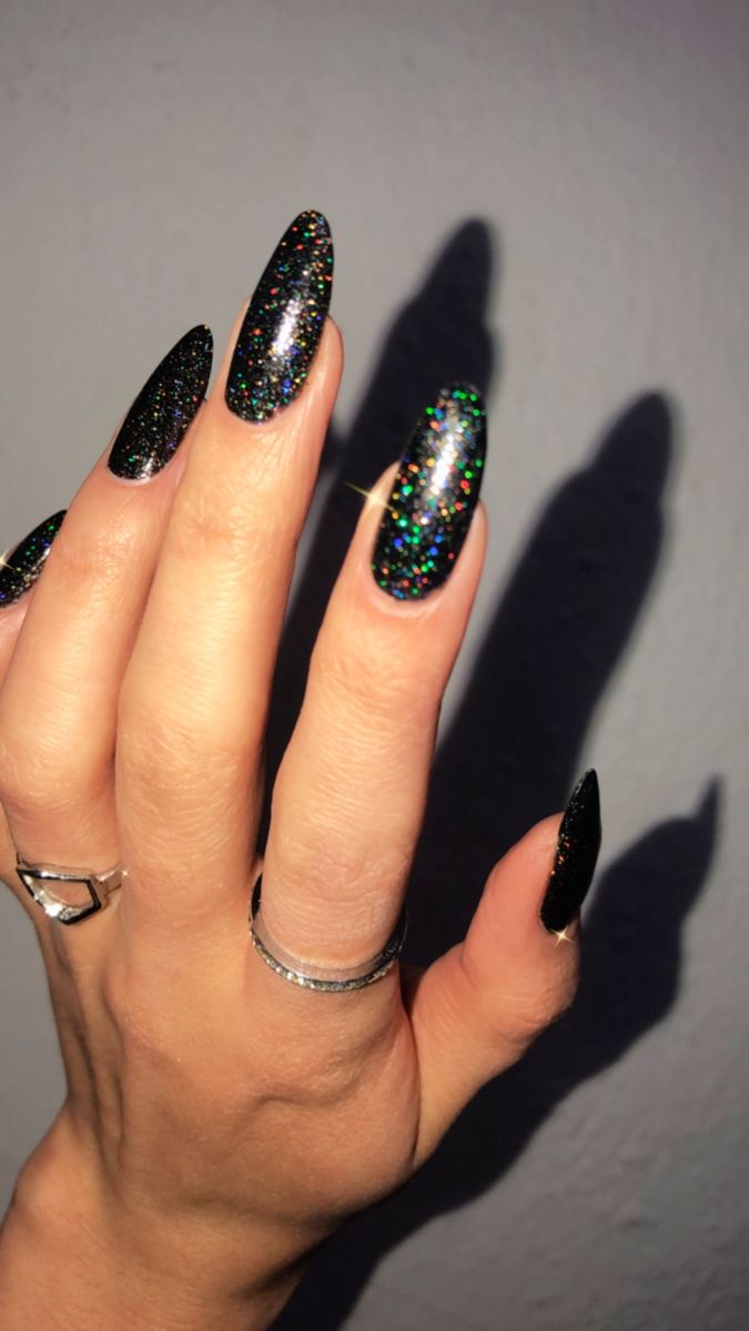 Elegant Sparkly Black Nails with Holographic Finish for a Chic Glamorous Look.