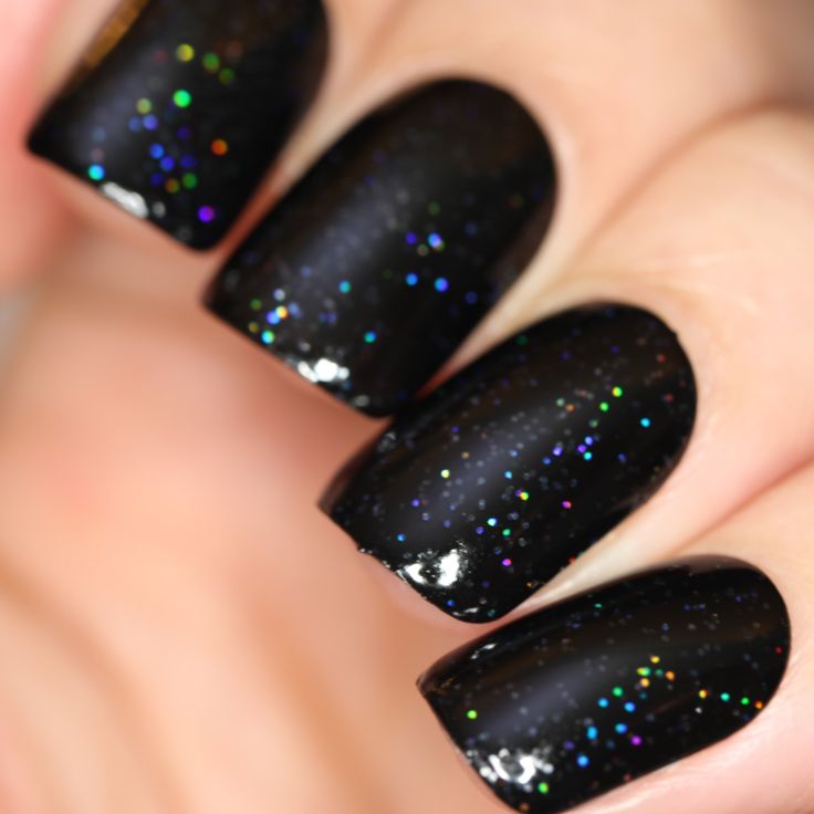 Glamorous Black Nail Design with Holographic Glitter Effect