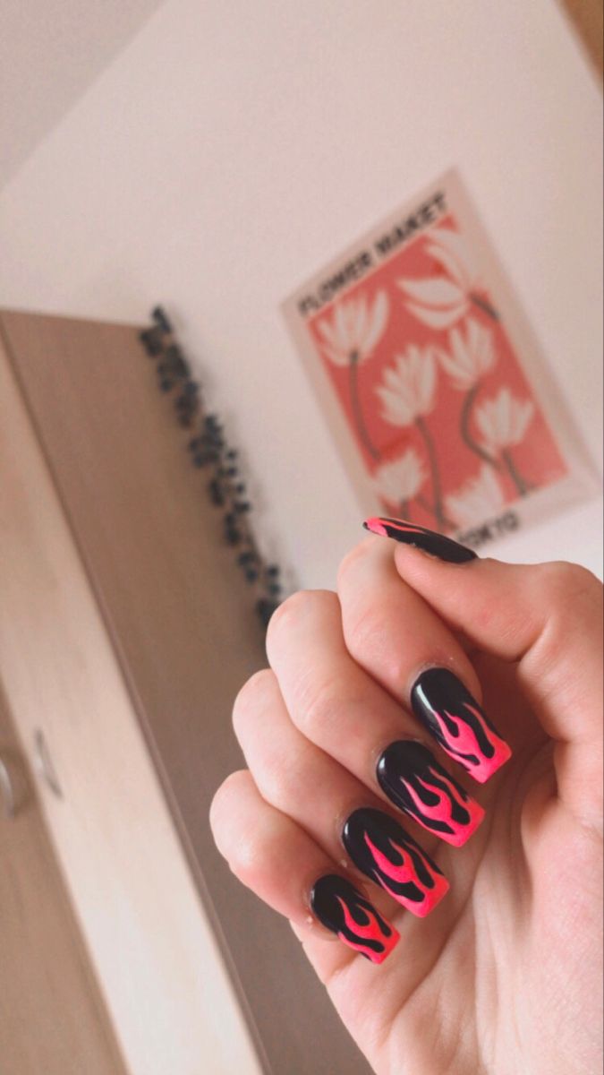 Bold Flame-Inspired Nail Design with Vibrant Pink Tips on Black Base