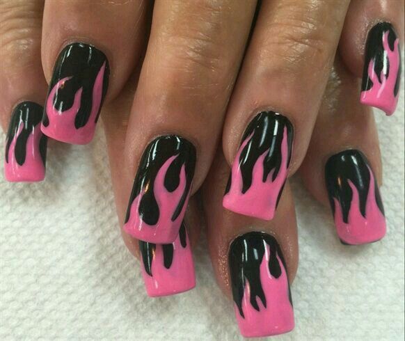 Vibrant Pink and Bold Black Flame-Inspired Nail Design for a Statement Look.