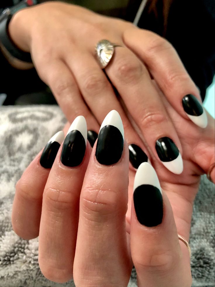 Bold Black and White Almond-Shaped Nail Design for a Chic Statement Look.