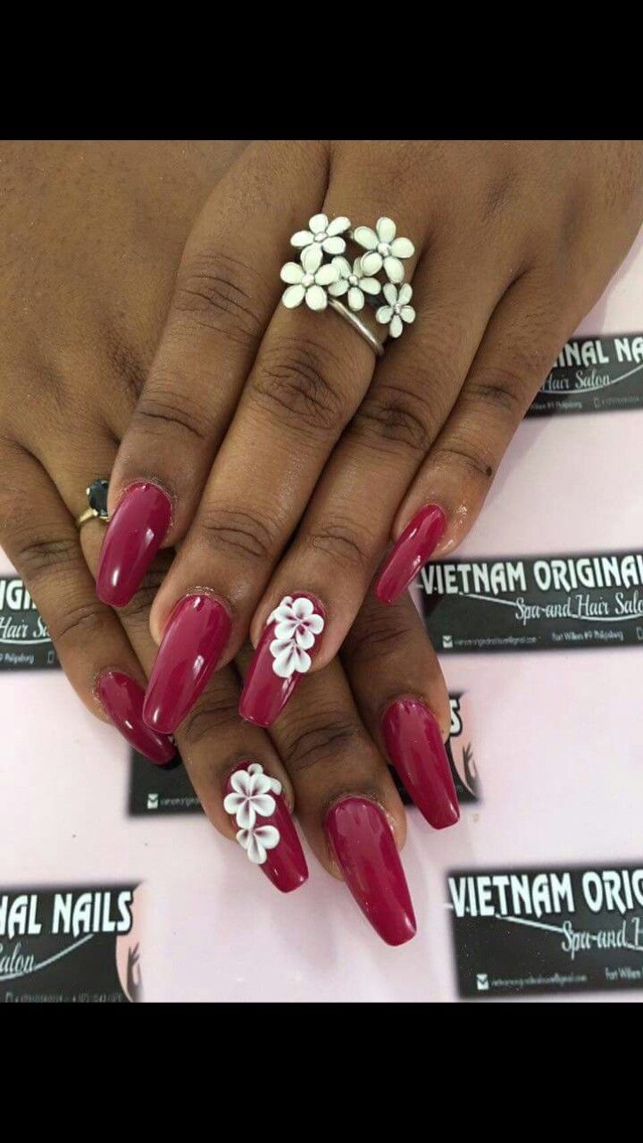 Charming Elegant Deep Red Nails with Whimsical Floral Accents.