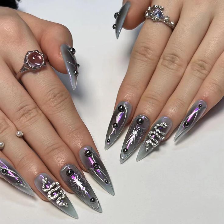 Glamorous Grey Long Nails with Intricate Designs and Sparkling Accents