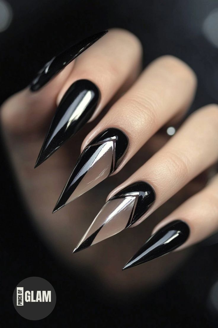 Bold and Sophisticated Stiletto Nails with Glossy Black and Elegant Nude Tones.