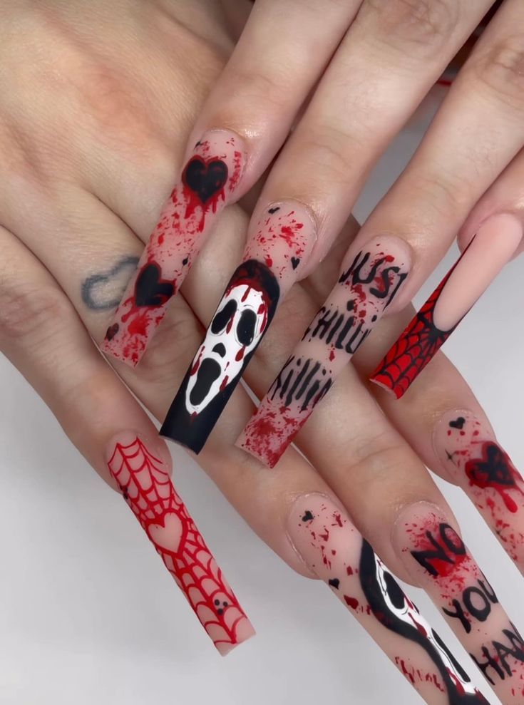 Bold Spooky Nail Design: Spider Webs, Hearts, and Blood Splatter for a Striking Halloween Look.