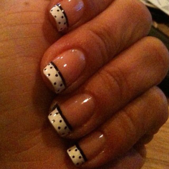 Chic French Manicure with Playful Polka Dots: A Stylish Statement of Elegance and Whimsy.