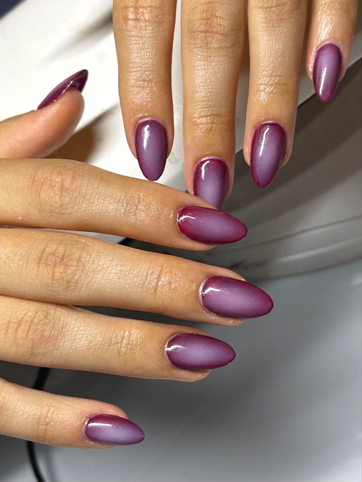 Chic Almond-Shaped Ombre Nails: A Sophisticated Burgundy-to-Lavender Gradient.