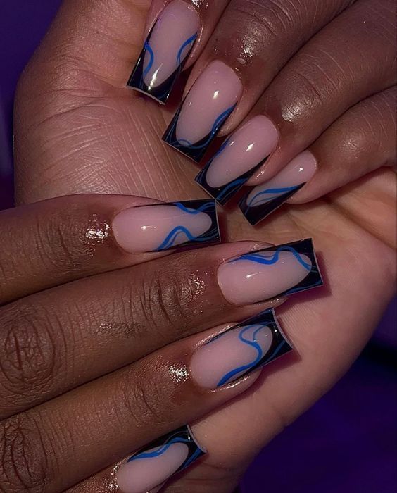 Elegant Elongated Nail Design: Nude Base with Black Tips and Vibrant Blue Waves