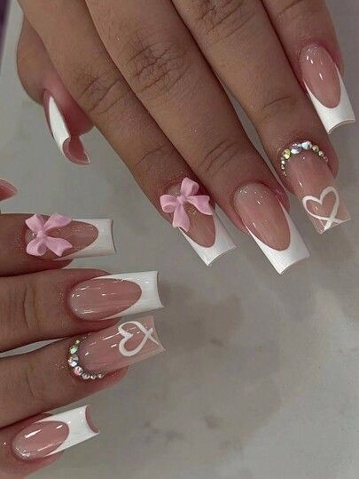 Elegant French Tip Nails with Playful Bows and Rhinestones