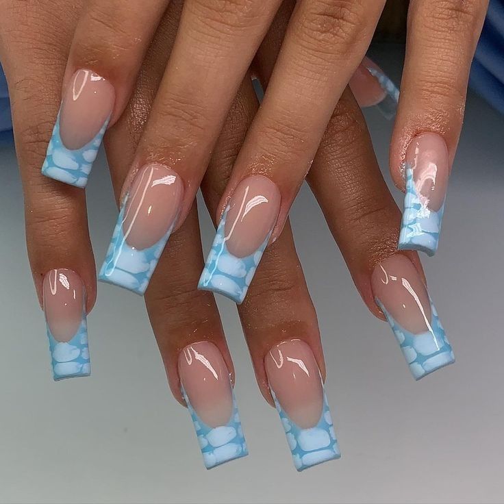 Elegant Nail Design: Soft Nude Gradient with Whimsical Sky Blue Cloud Tips