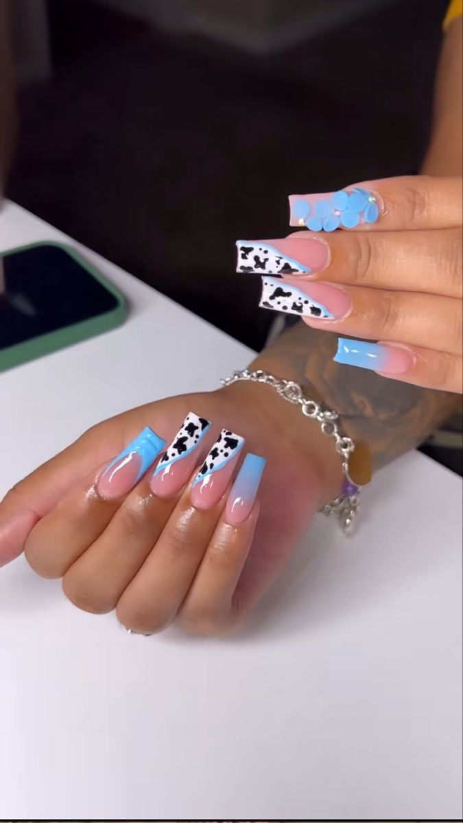 Whimsical Pastel Nail Design with Glossy Finishes and Playful Patterns