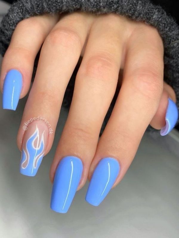 Playful Sophistication: Trendy Blue Nail Design with Flame Accents