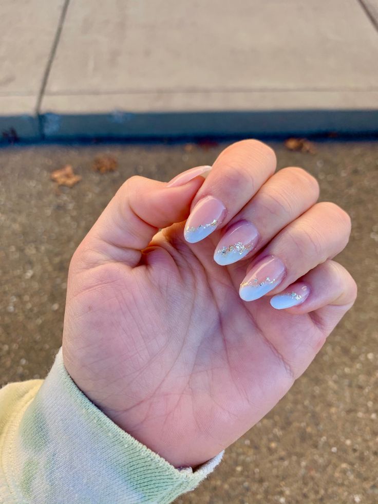 Chic Pastel Blue Nail Design with Glittery French Tips for Effortless Glamour.