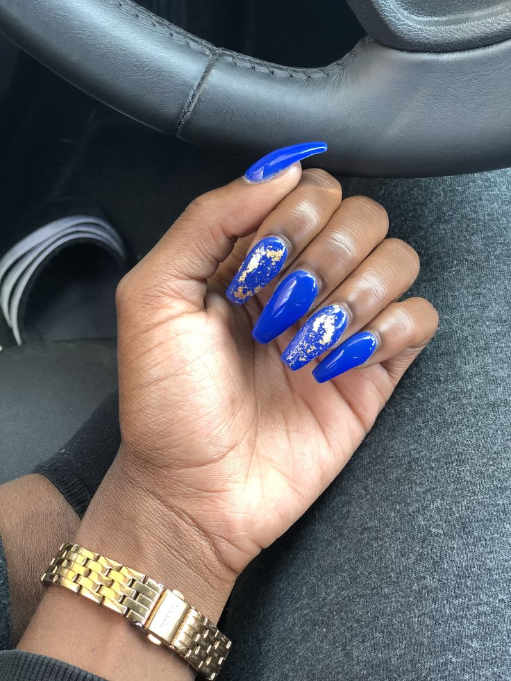 Striking Blue and Gold Almond-Shaped Nail Design: Bold Elegance for Any Occasion.