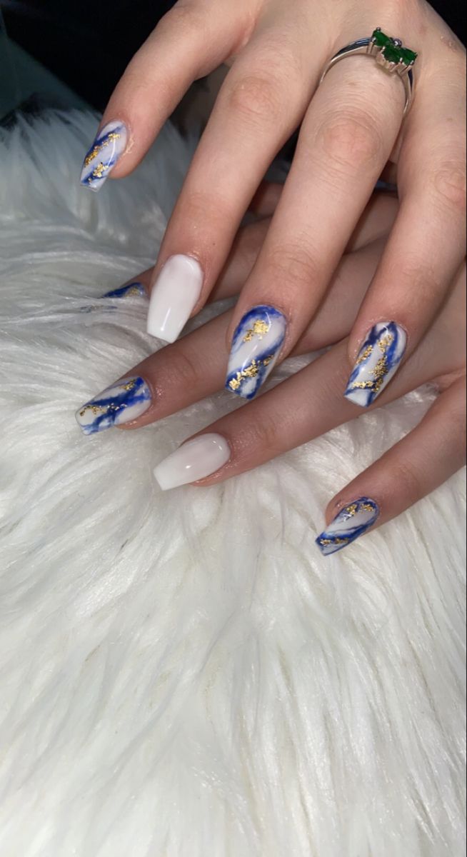 Chic Nail Designs: Vibrant Blue and White with Gold Accents and Textured Finishes.